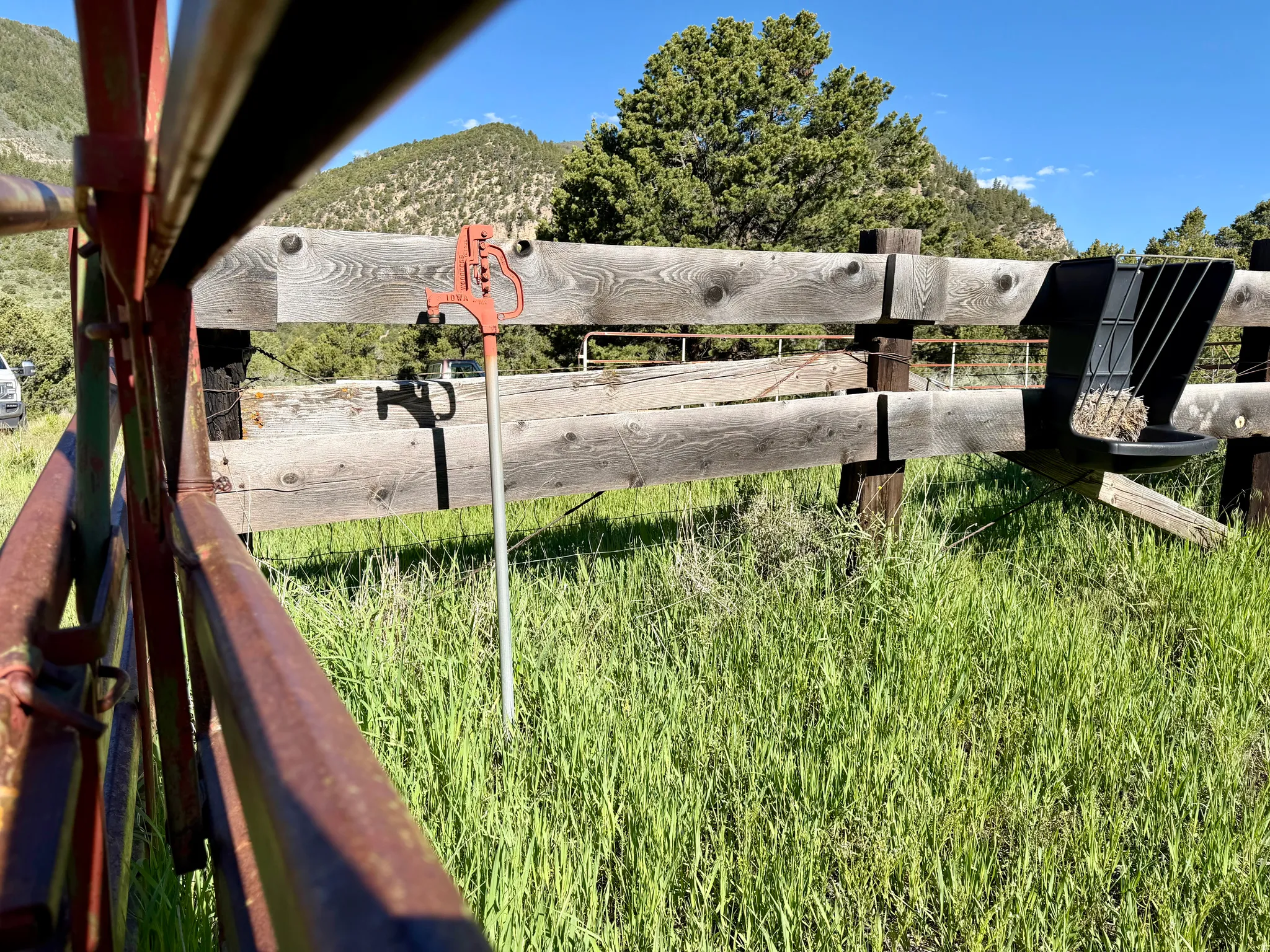 Property perimeter featuring a wooden fence and metal gate, with a frost-free yard hydrant for exterior water access