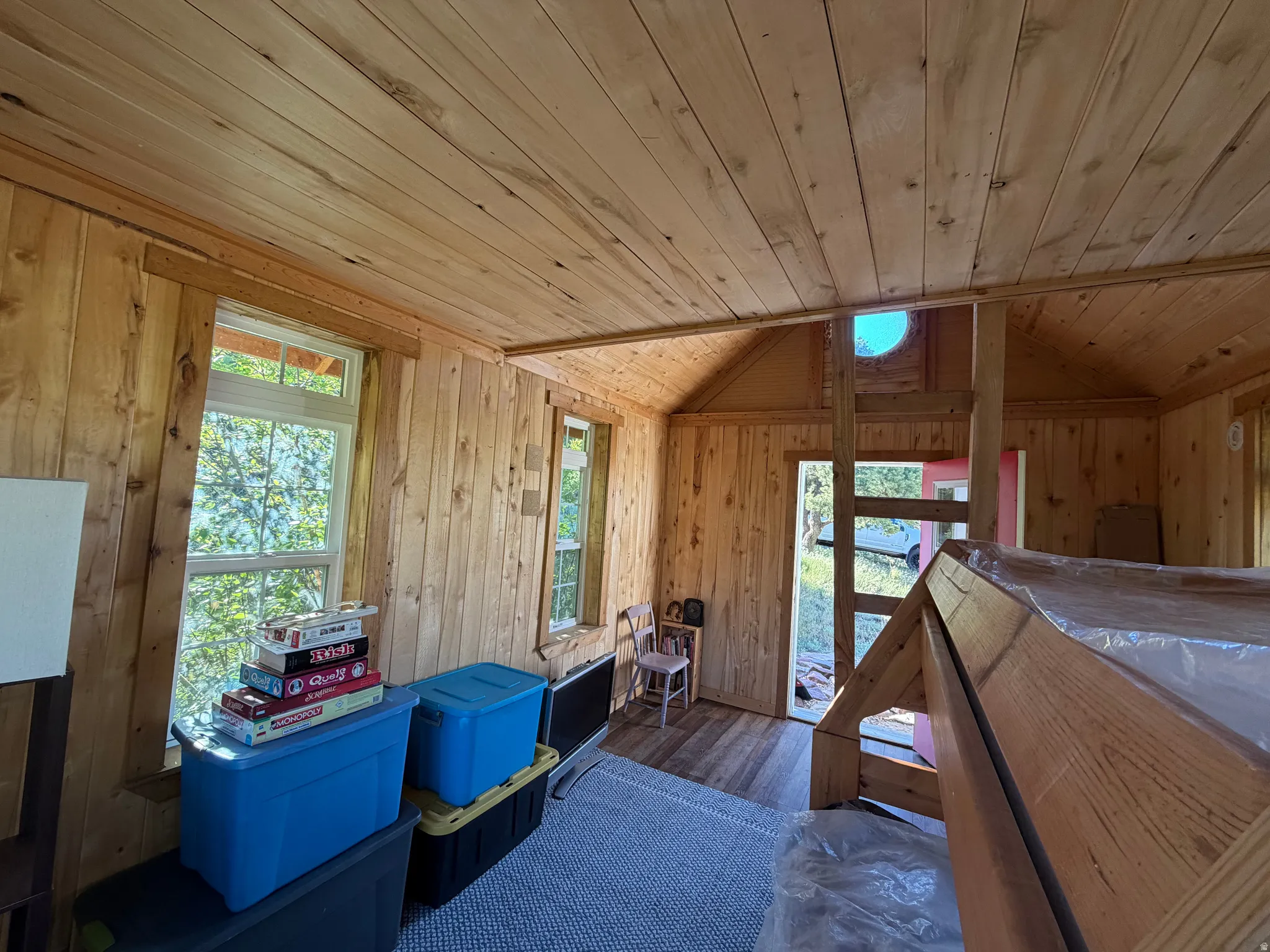 Natural wood plank walls and ceiling