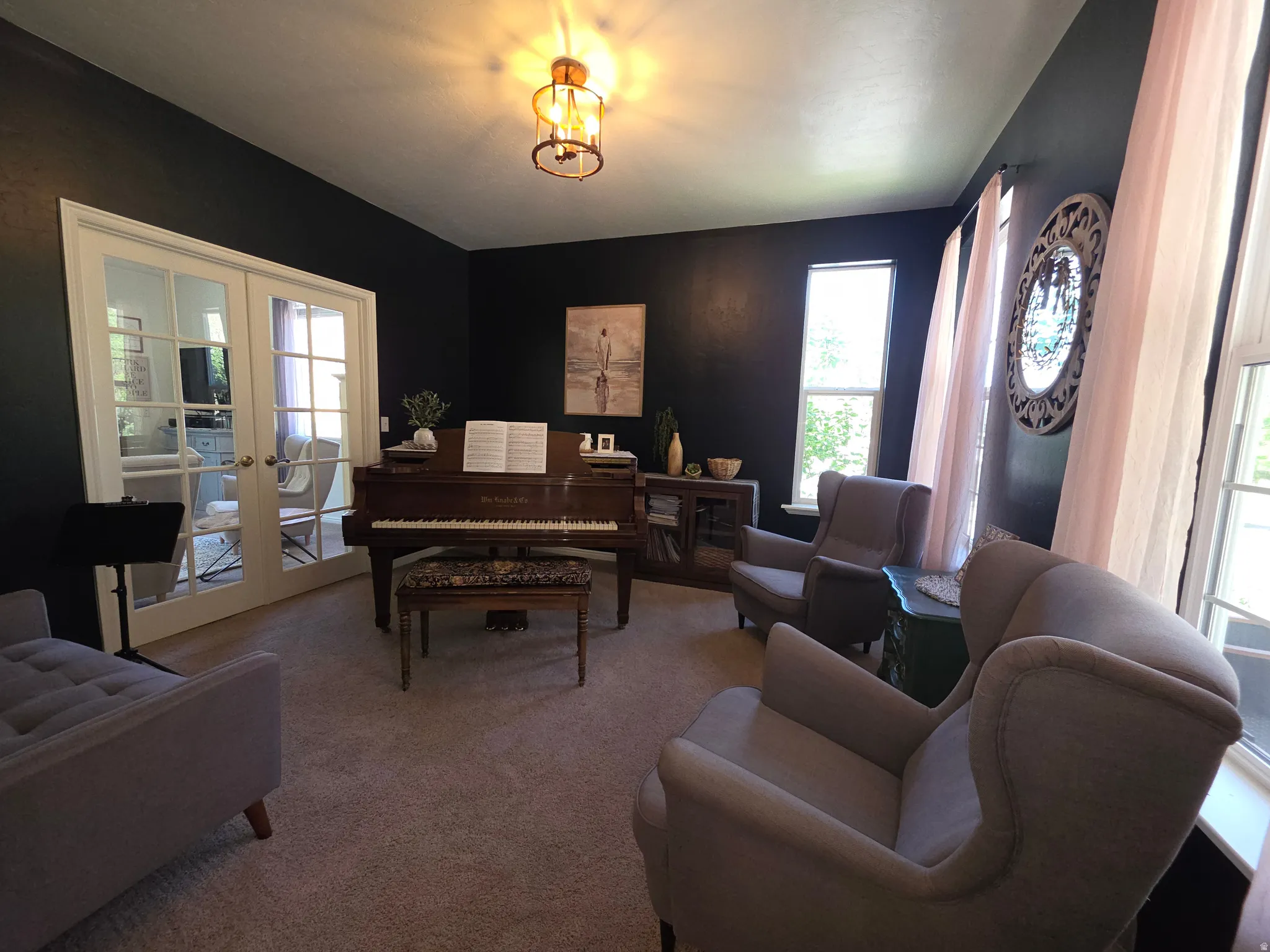 Room with dark-painted walls and light-colored carpeting