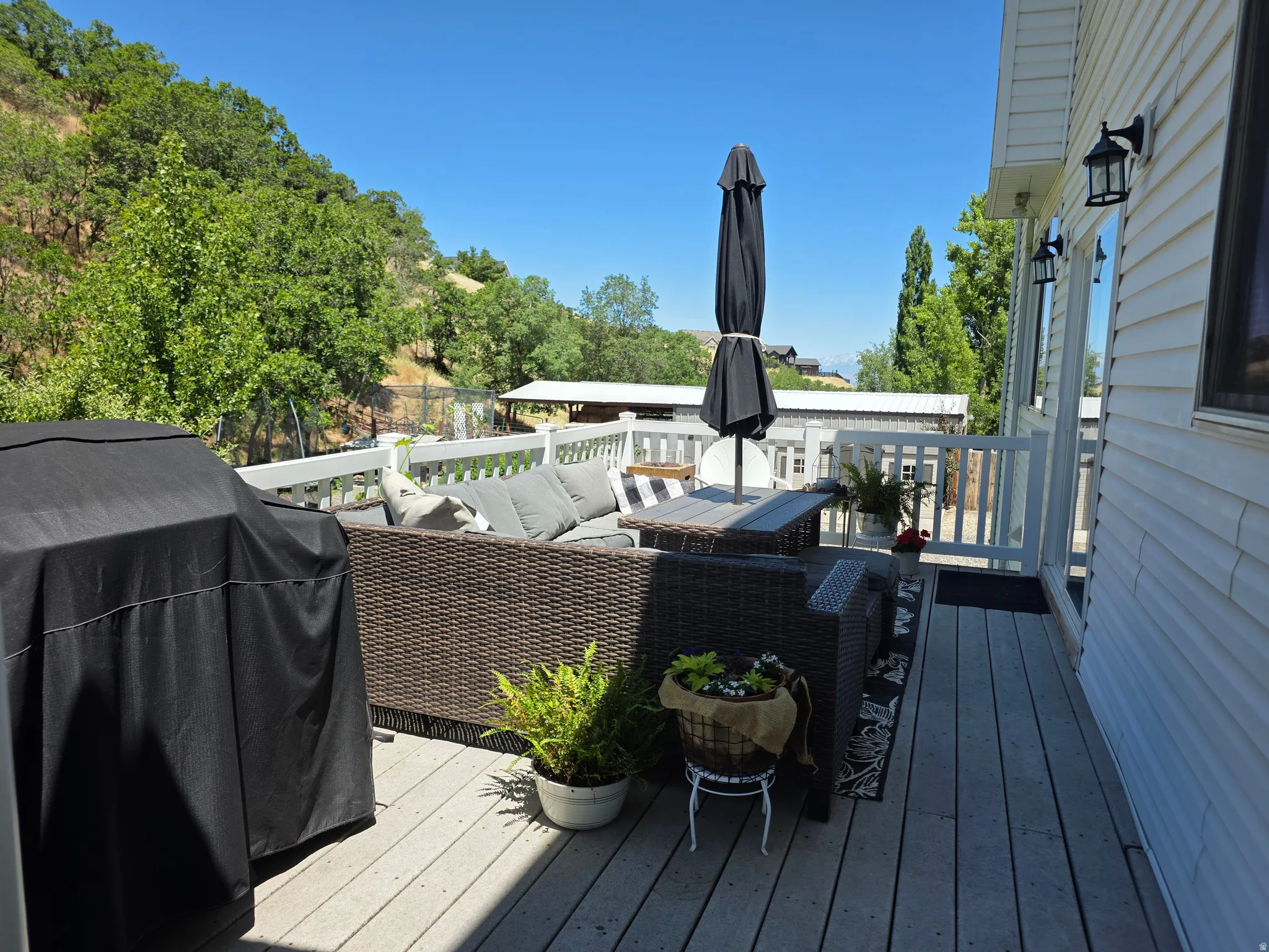 Expansive outdoor deck featuring composite decking and white railings