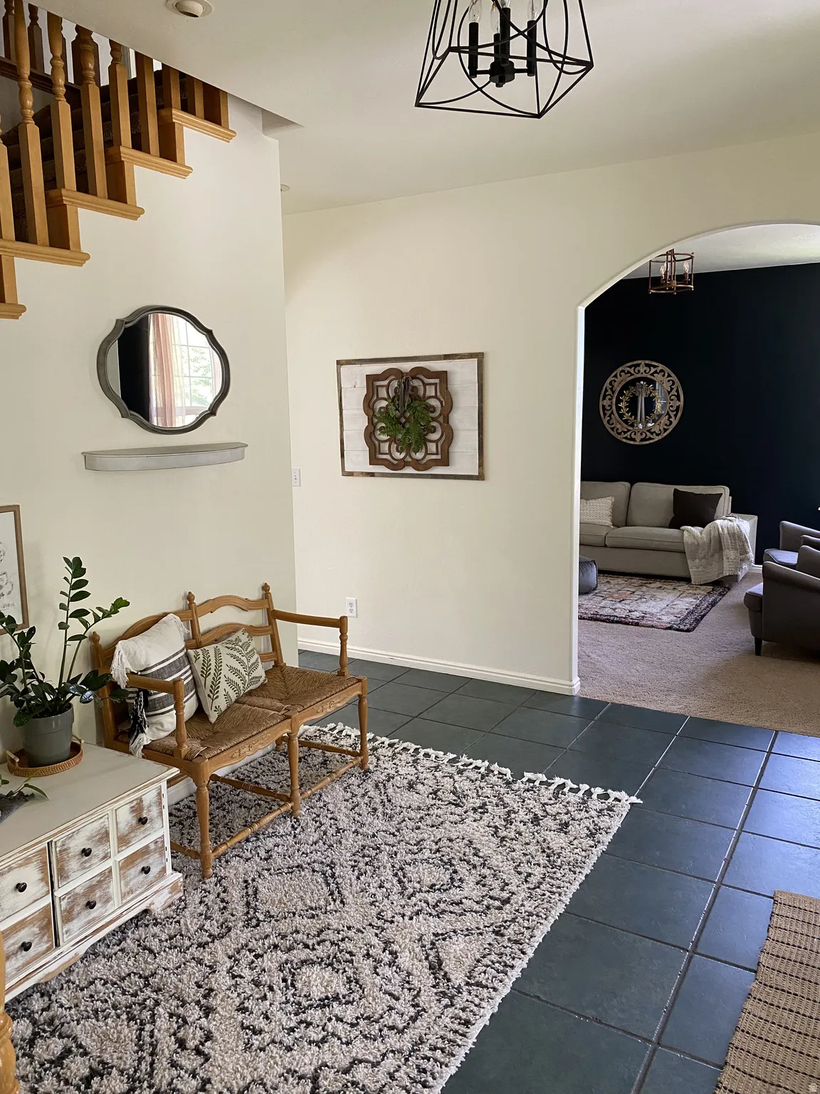 Entryway featuring dark square tile flooring