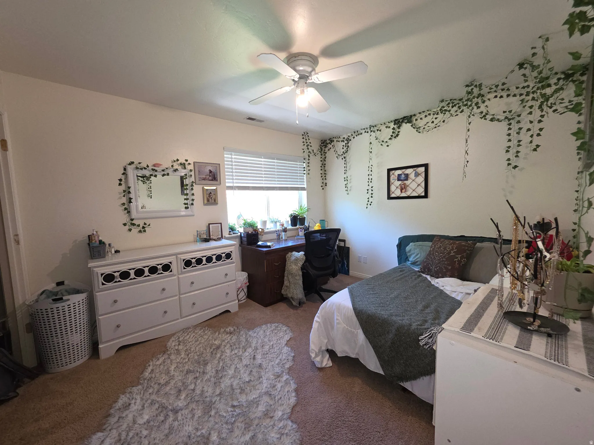 Bedroom #4 Carpeted room featuring a ceiling fan with integrated lighting, a window with blinds, and white walls