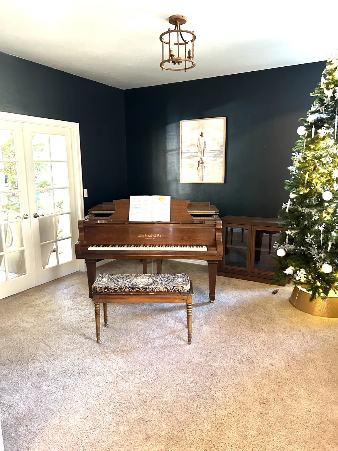 Interior space featuring dark accent walls and light carpeting