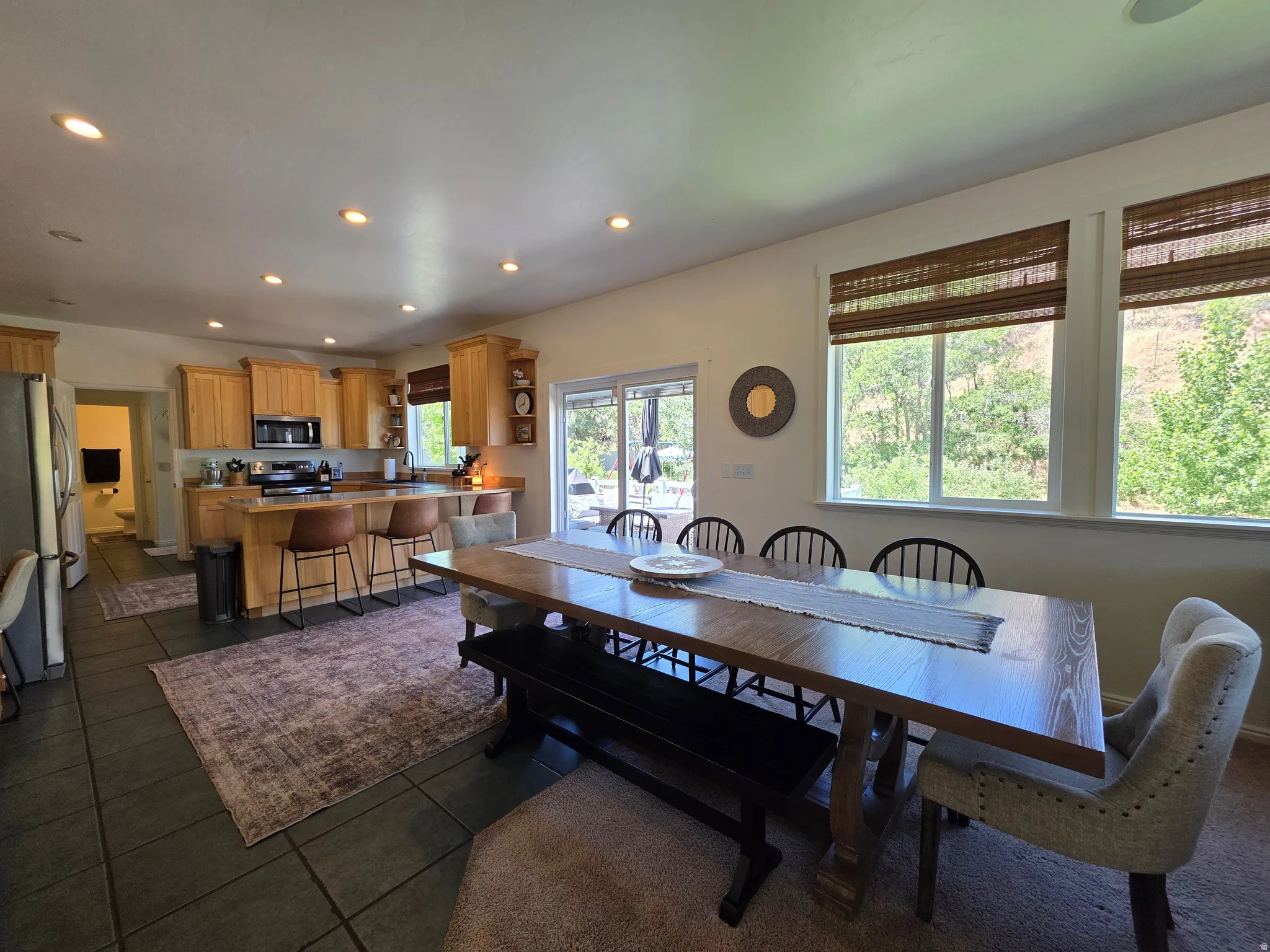 Open-concept kitchen and dining area featuring recessed lighting throughout