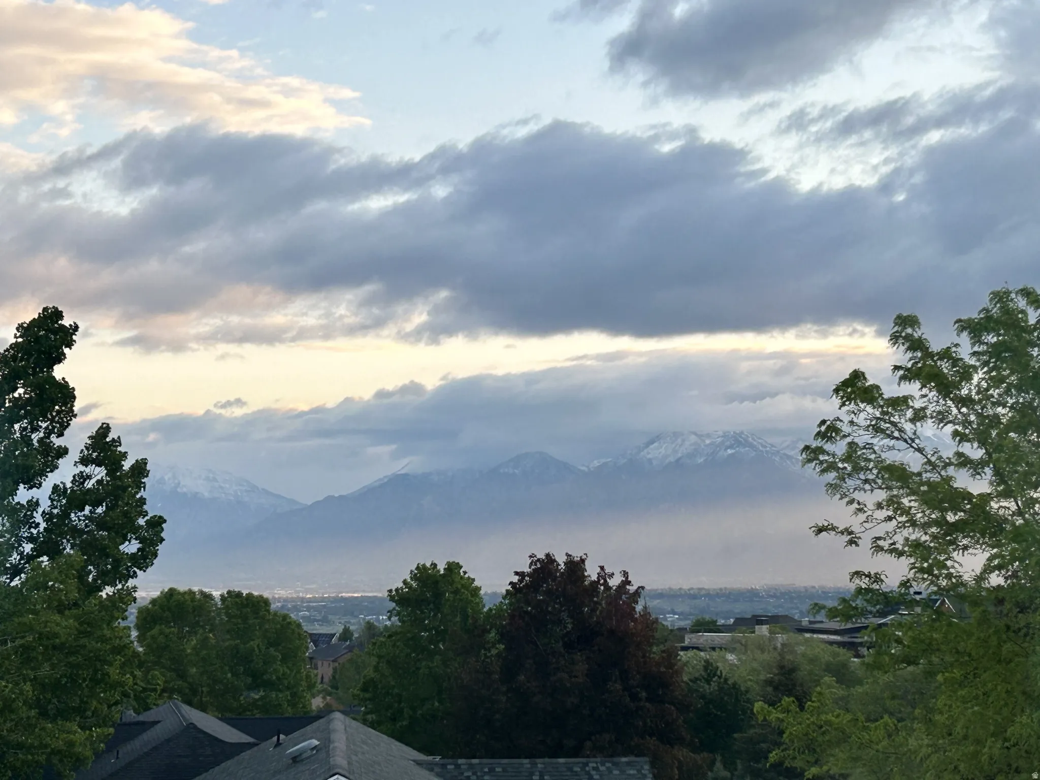 Panoramic mountain scenery featuring distant snow-capped peaks