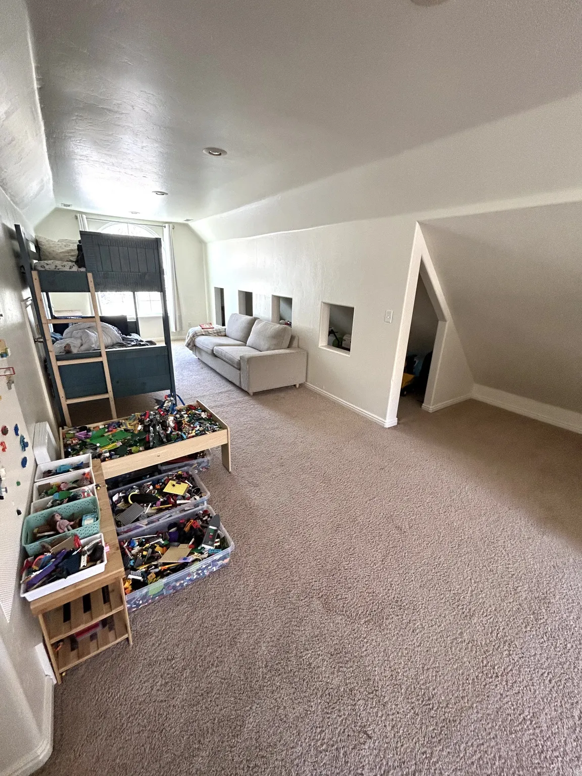 Bedroom $#5 Carpeted loft room with sloped ceilings and recessed lighting