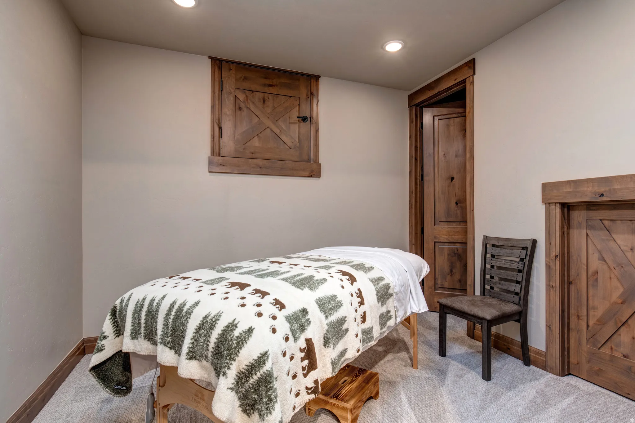 Interior room featuring light-toned walls, recessed lighting, and soft gray carpeting