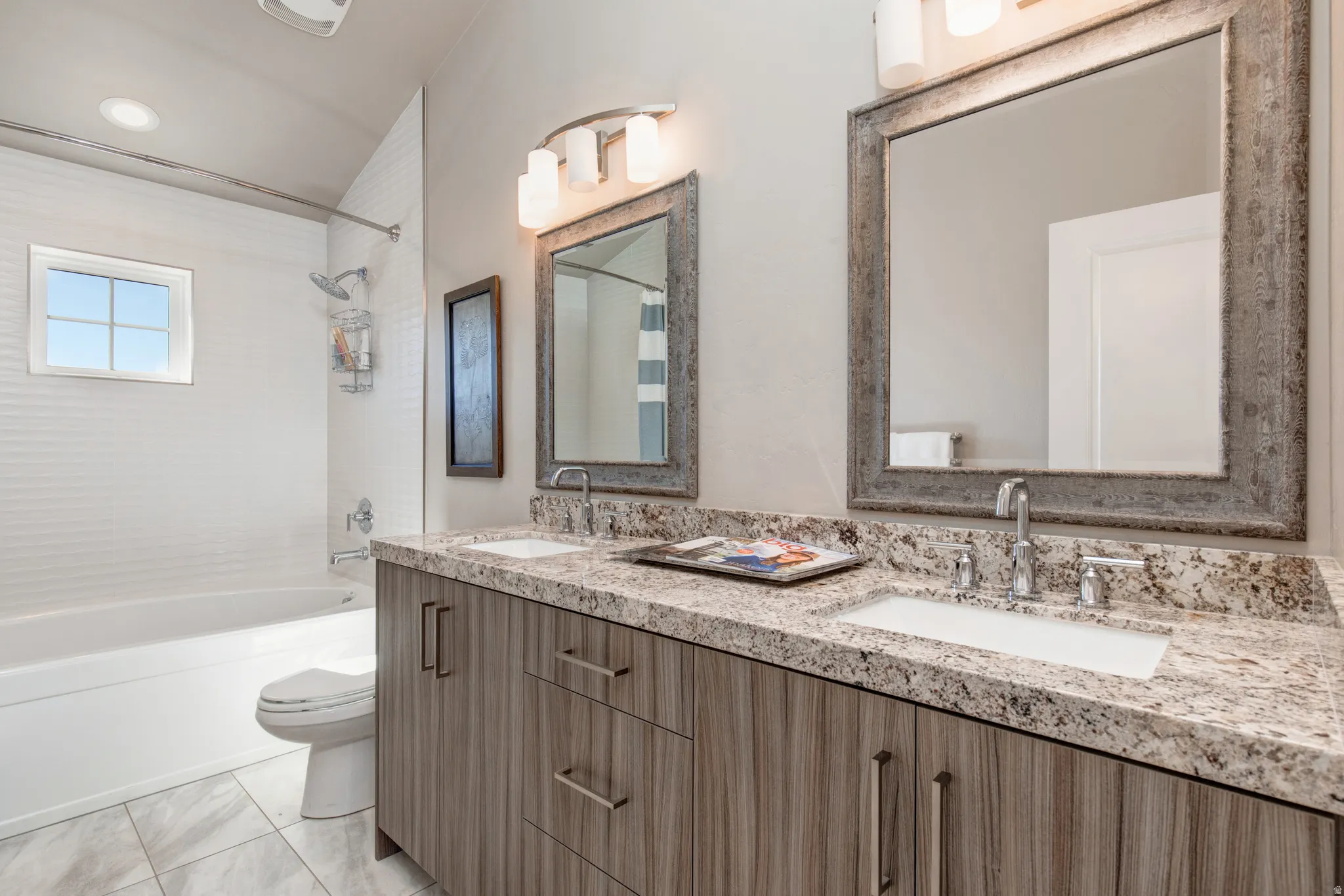 Double vanity with under-mount sinks and granite-finish countertops