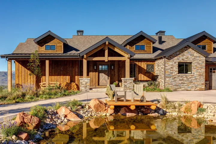 Craftsman-style exterior with natural wood siding and stone veneer accents