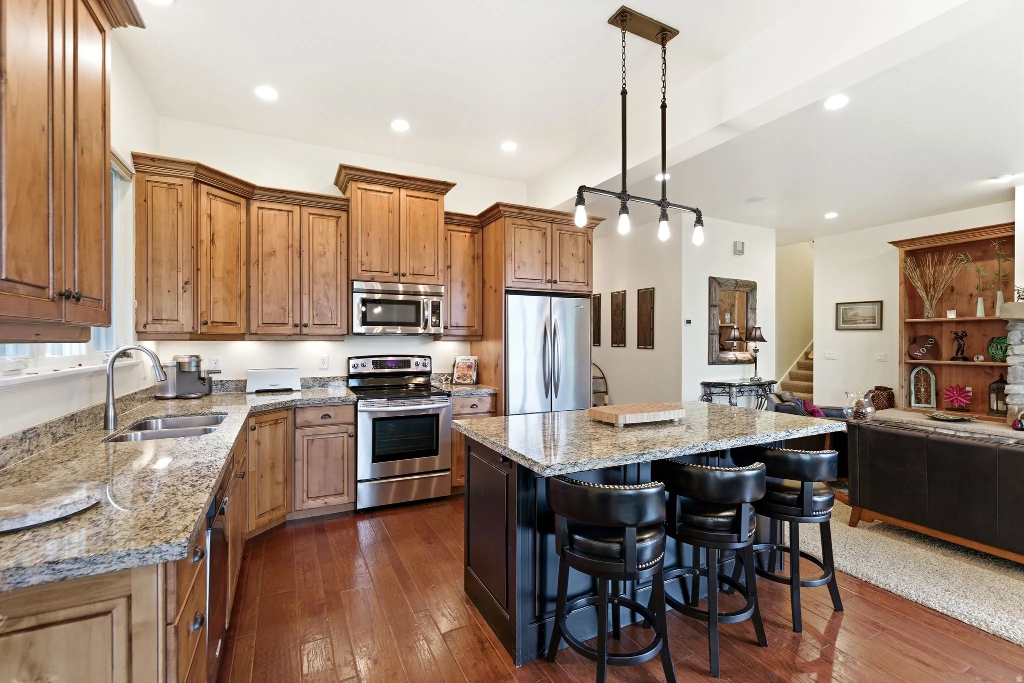 Kitchen featuring wood-finish flooring, recessed lighting, and a multi-light industrial chandelier
