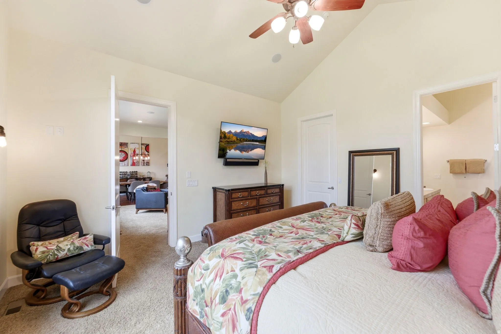 Vaulted ceiling bedroom with a ceiling fan, recessed lighting, and carpet flooring