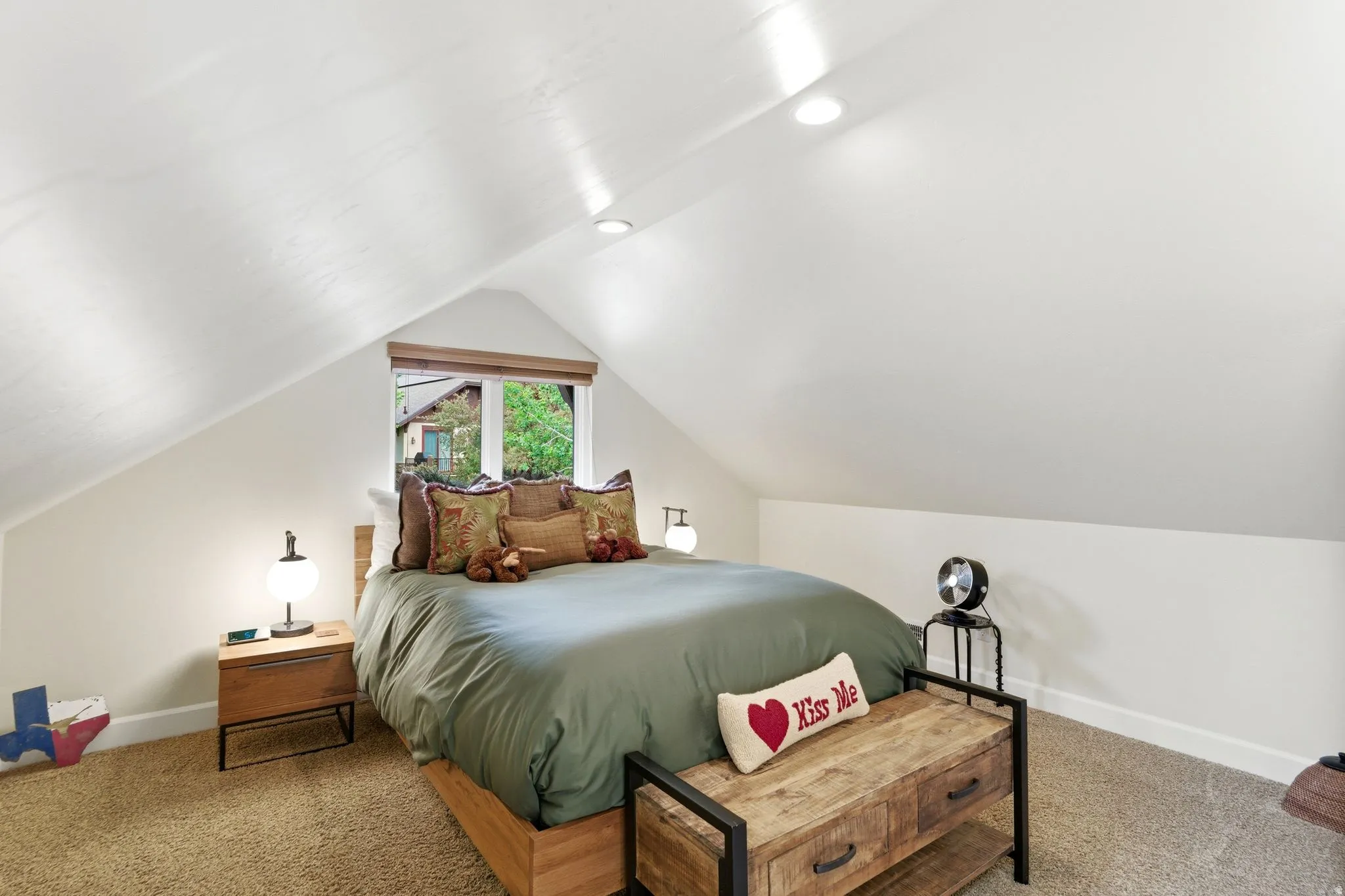 Gabled ceiling room featuring a window with wood-finish blinds, recessed lighting, and soft carpet flooring