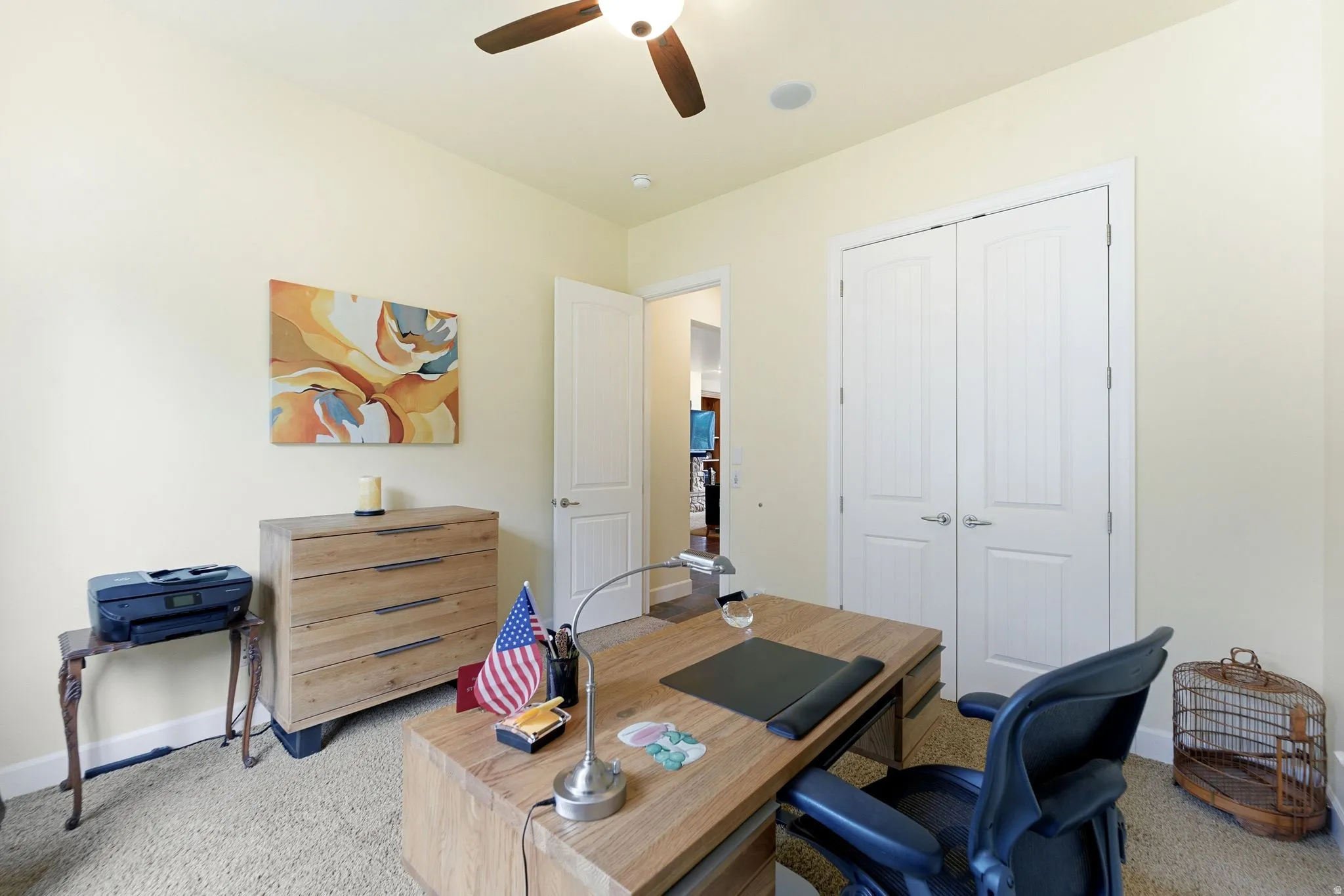 Room featuring light-toned walls, recessed lighting, and a ceiling fan