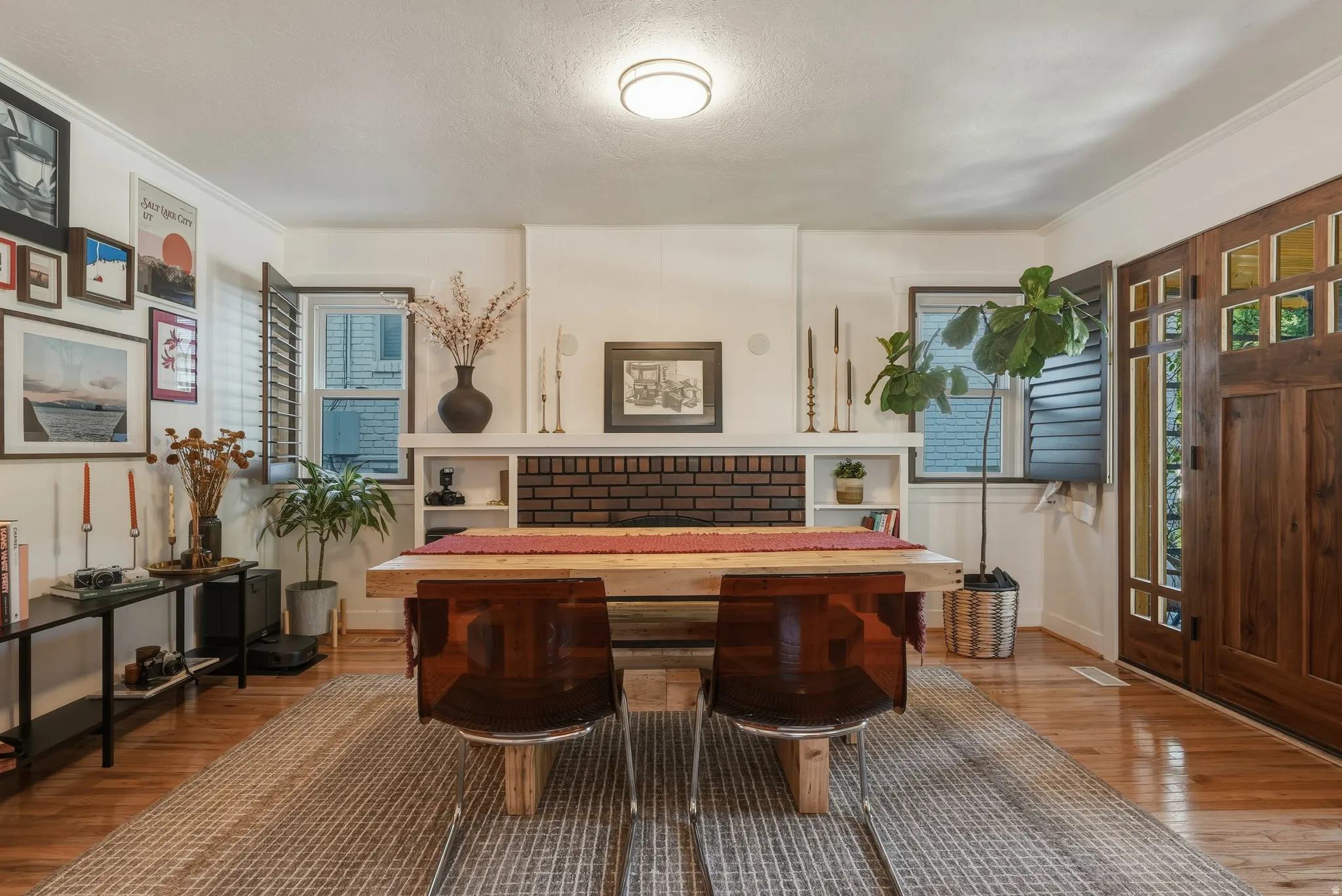 Living area featuring wood-finish flooring and a central area rug