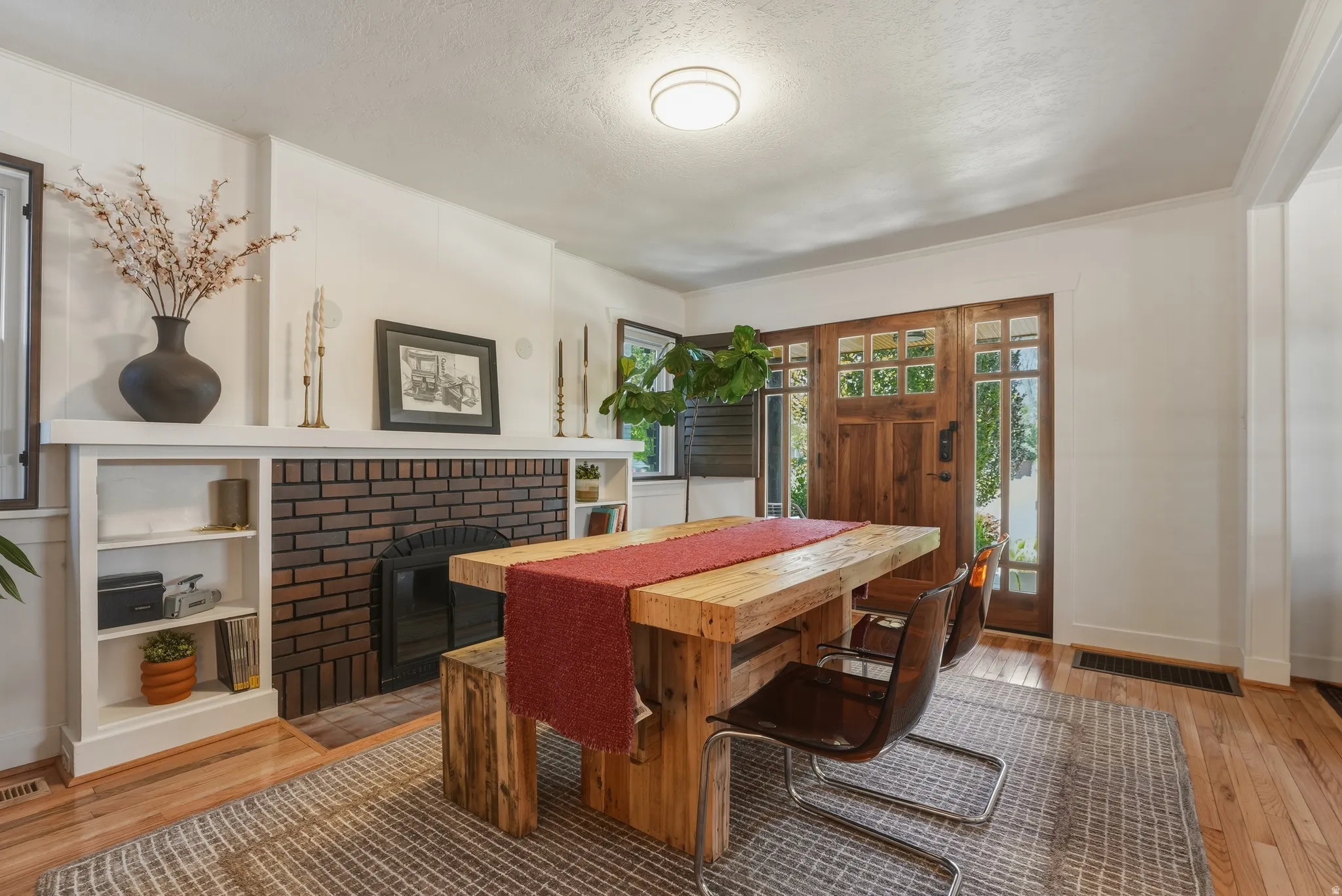 Entryway featuring a wood-paneled door with glass inserts and side windows