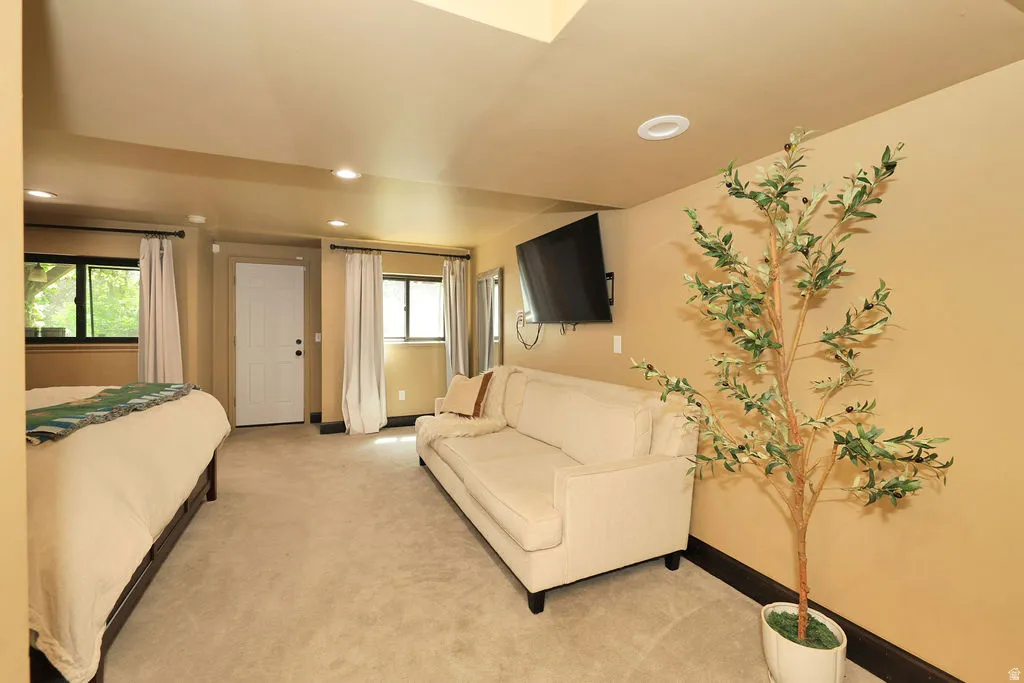 basement family room currently being used as primary bedroom. Walk out to outside covered porch.