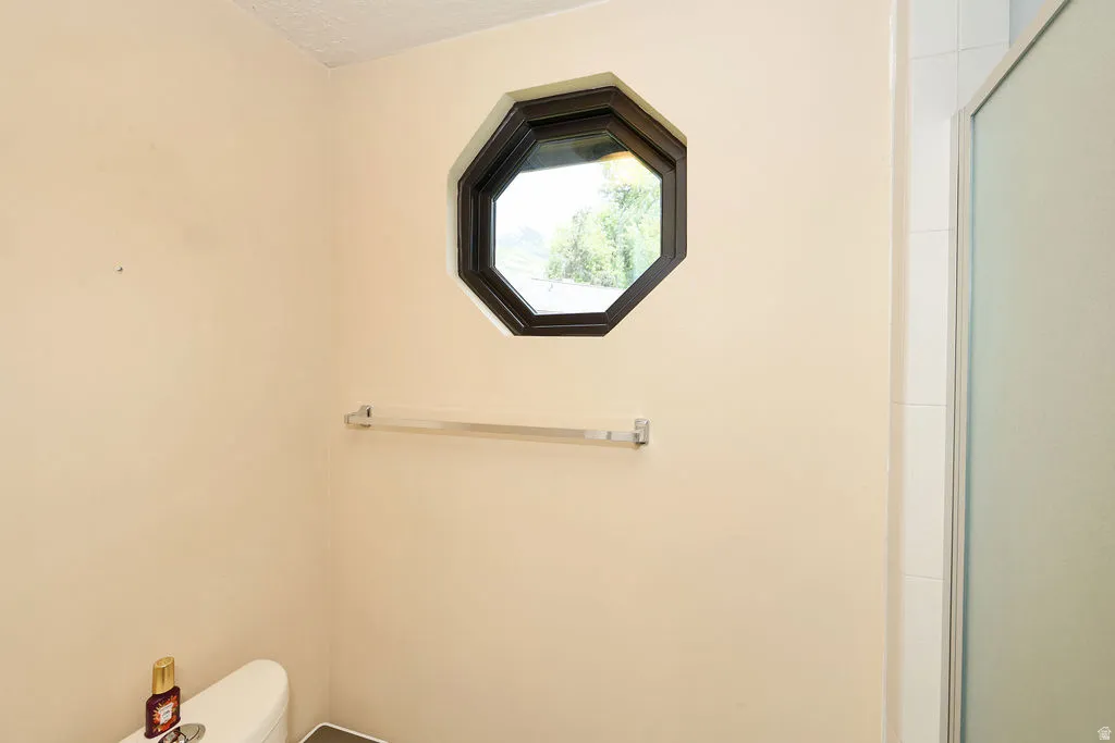 2nd floor primary bathroom water closet and shower.