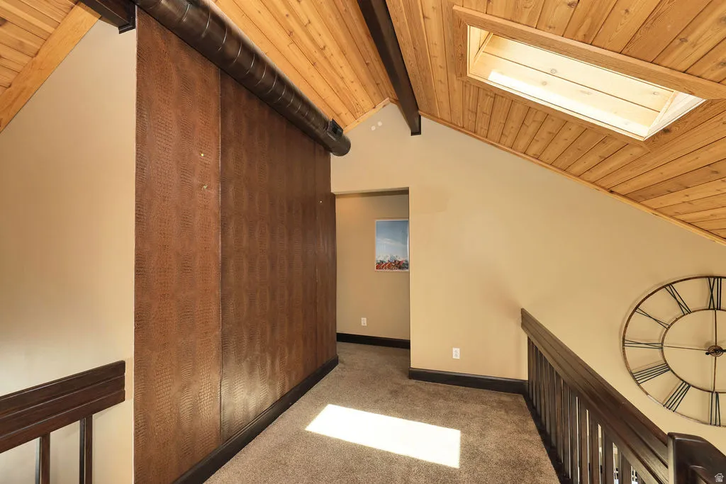 bonus space at top of the stiars. Vaulted wood-plank ceiling with exposed beams and a skylight
