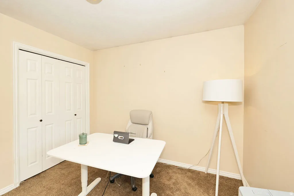 Second floor bedroom (3 of 3 up). Room with neutral wall paint and brown carpet flooring