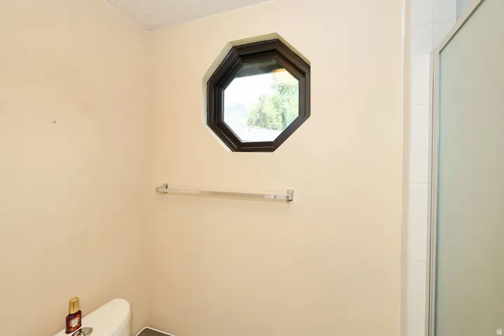 2nd floor primary bathroom water closet and shower.