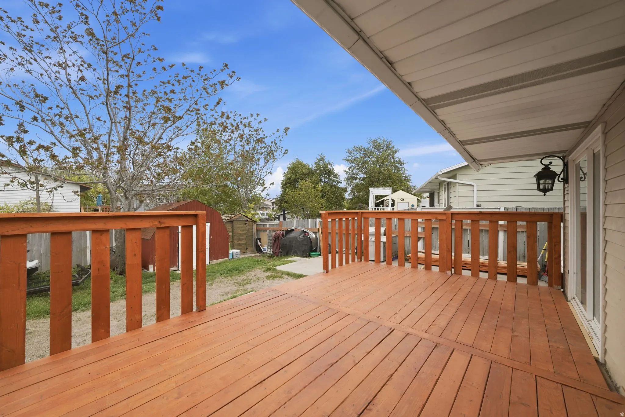 Expansive wooden deck with coordinating wooden railings