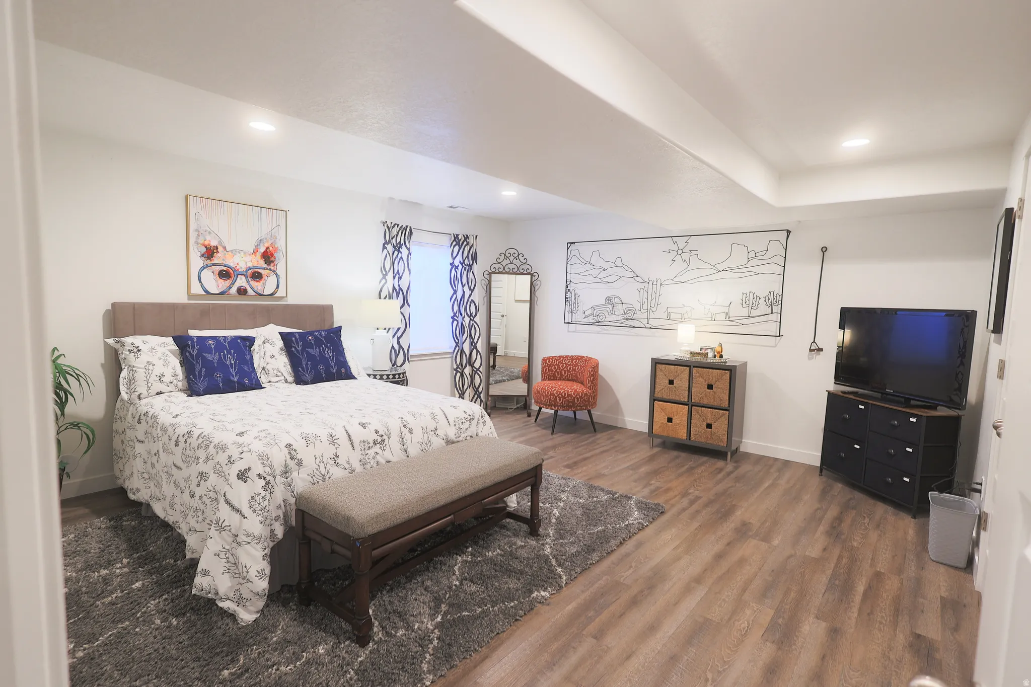 Spacious room featuring waterproof luxury vinyl plank flooring, recessed lighting, and a window