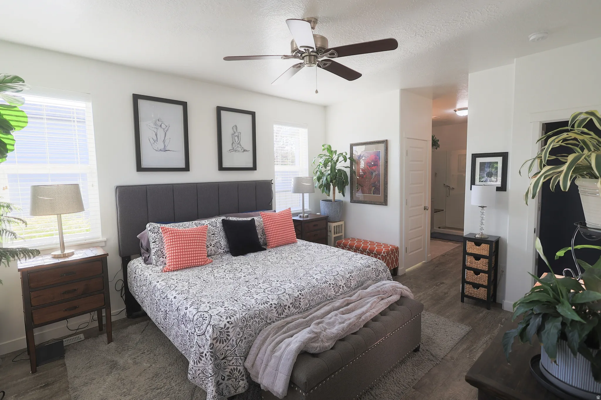 Spacious master bedroom featuring lots of light and waterproof luxury vinyl plank flooring