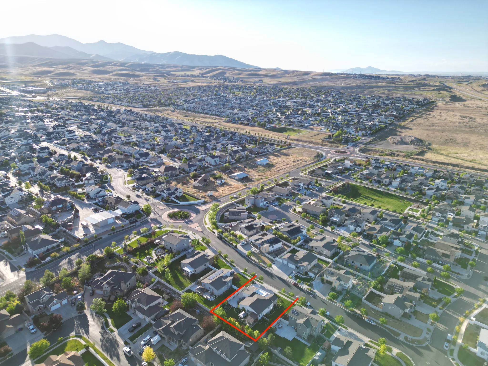 Aerial perspective showcasing a residential community with distant mountains