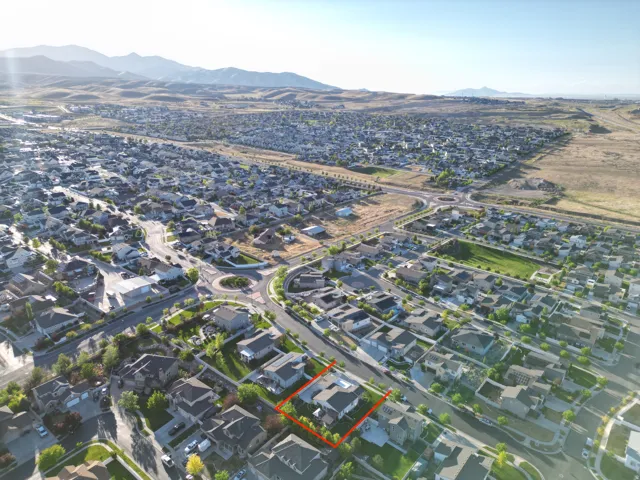 Aerial perspective showcasing a residential community with distant mountains