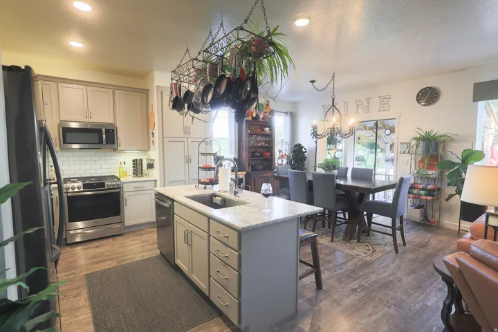 Kitchen and dining area featuring waterproof luxury vinyl plank flooring