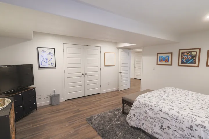 Spacious room featuring waterproof luxury vinyl plank flooring, white walls, and recessed lighting