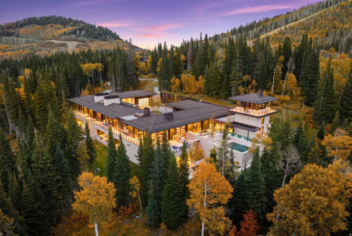 Expansive modern residence with multiple outdoor terraces, integrated swimming pool, and a rooftop observation deck