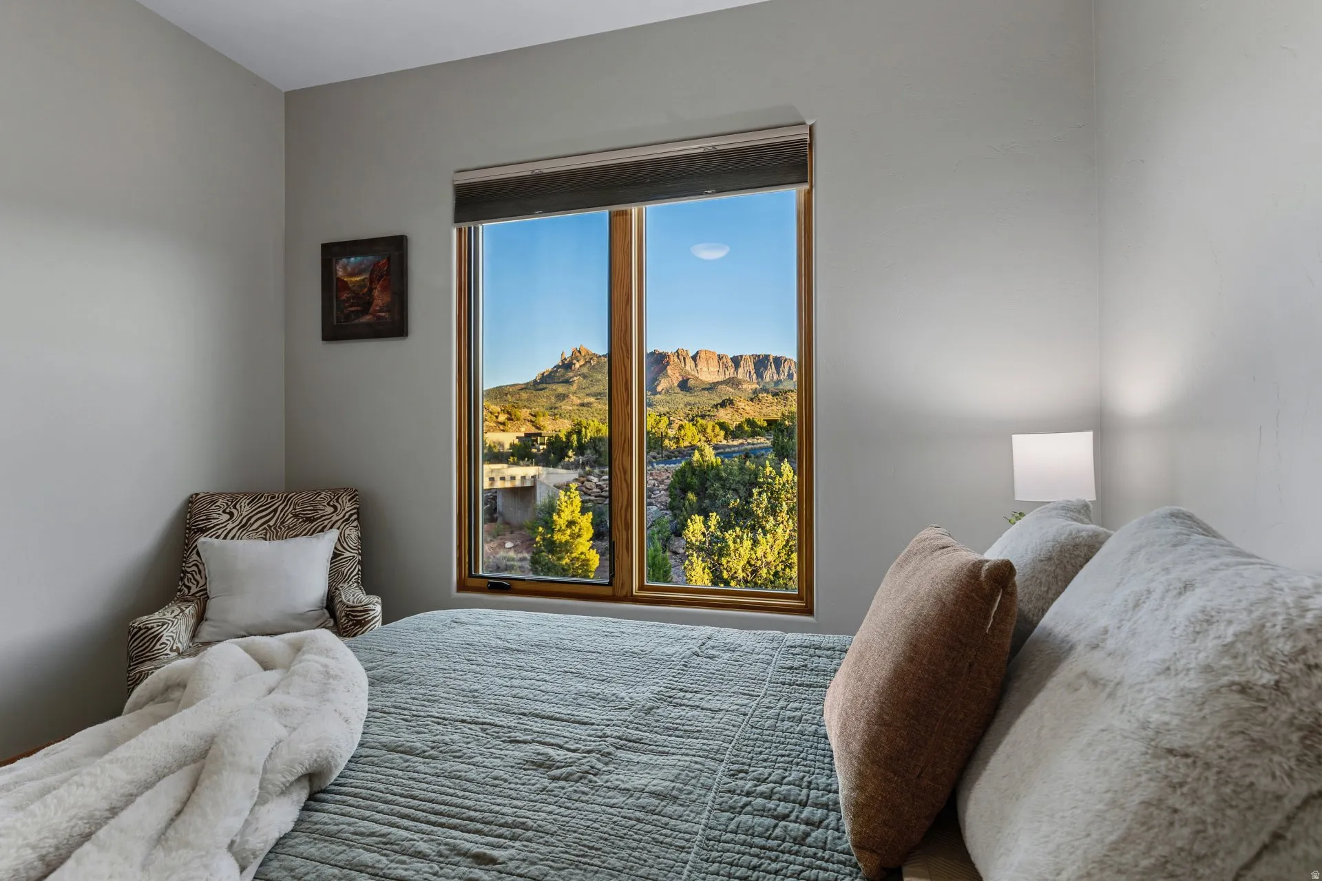 Expansive window framing desert mountain scenery