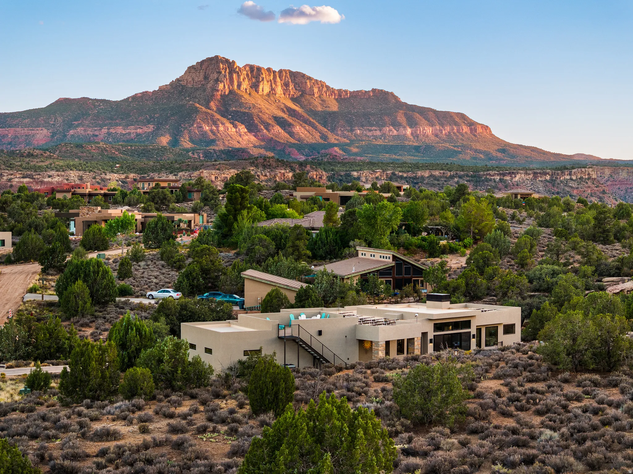 Contemporary desert residence featuring a flat roofline and multi-level design