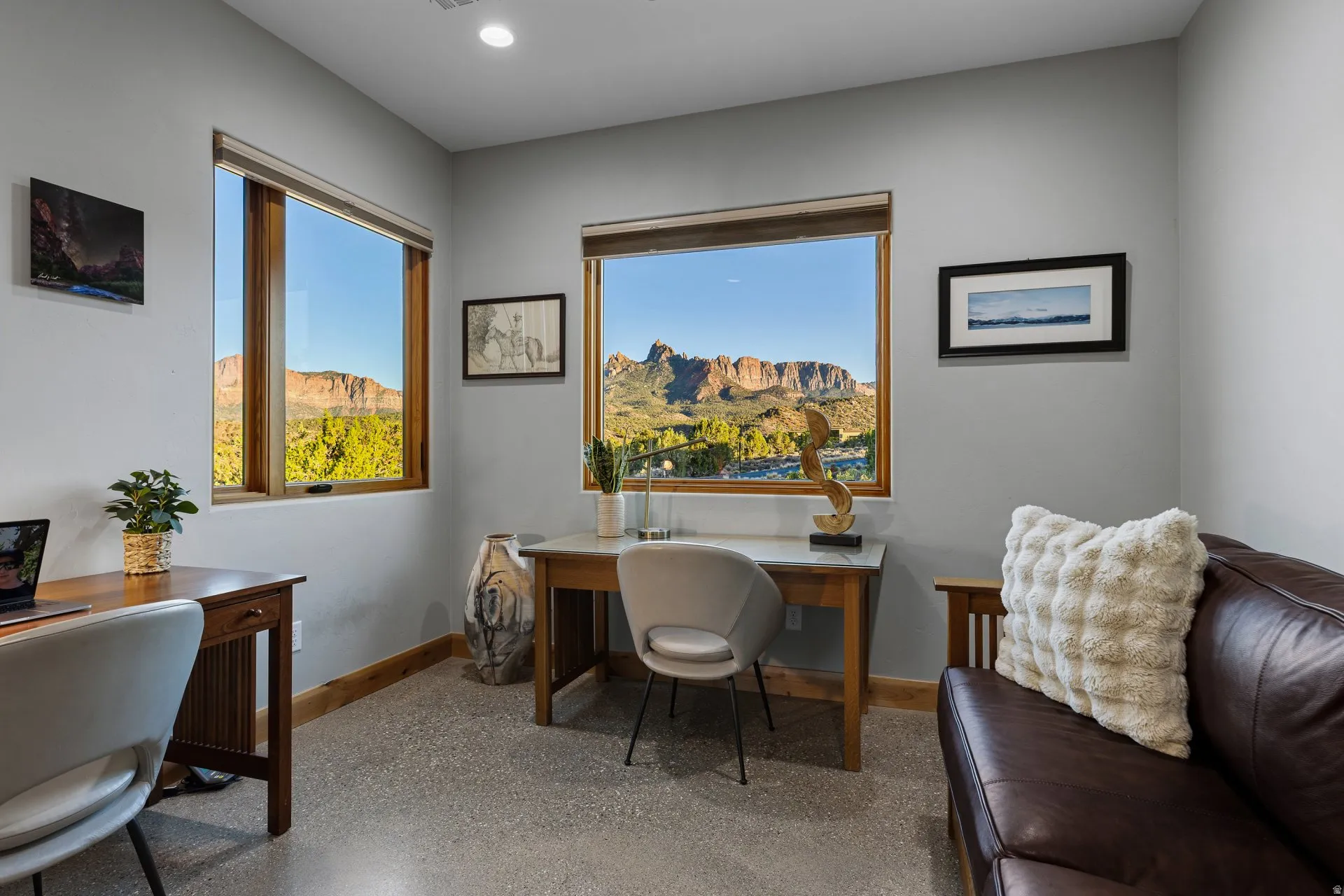 Spacious room featuring multiple large windows with natural wood frames, light gray wall finishes, recessed lighting, and durable flooring