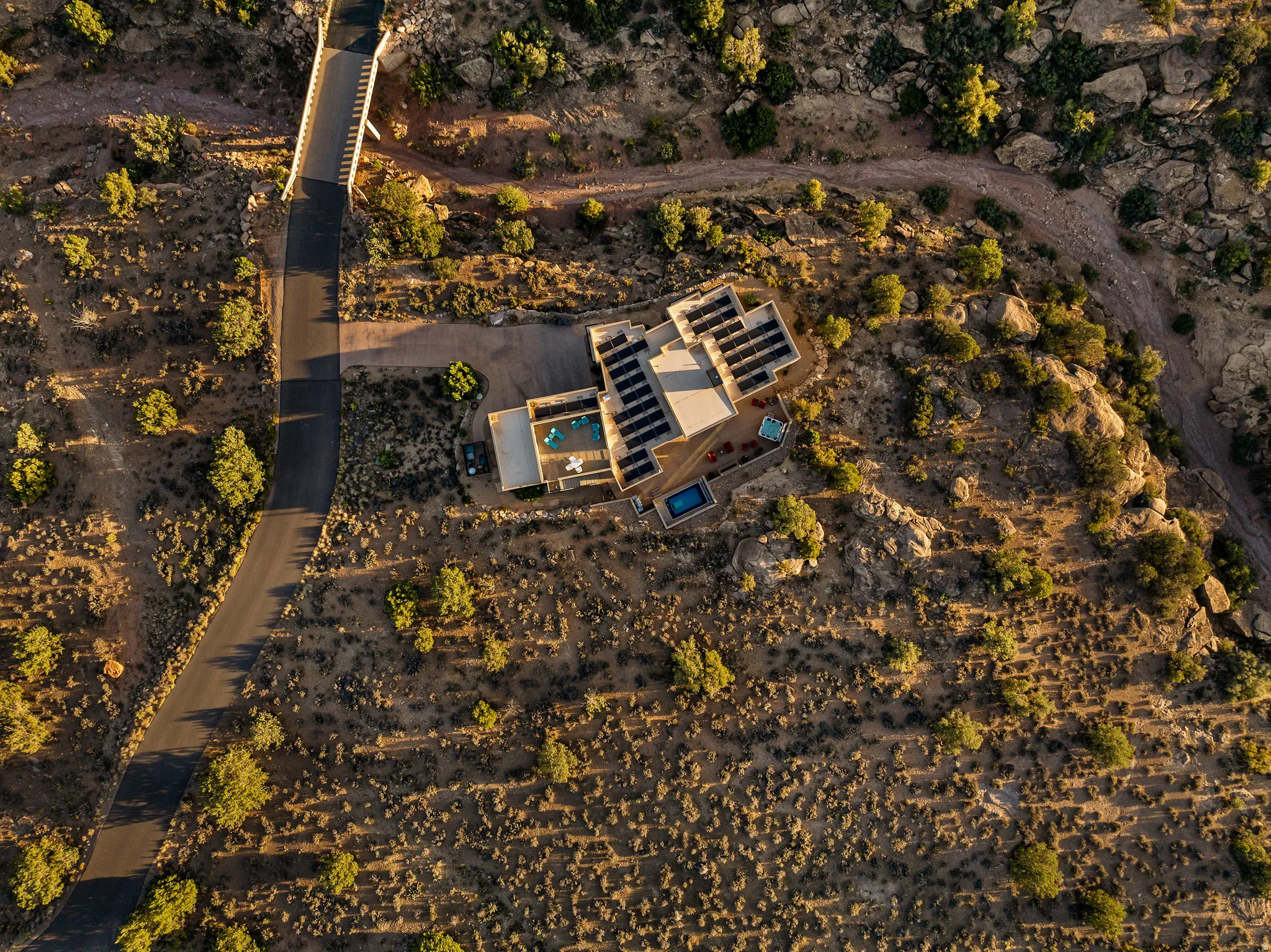 Overhead aerial illustrating the driveway, garage, and lot layout.