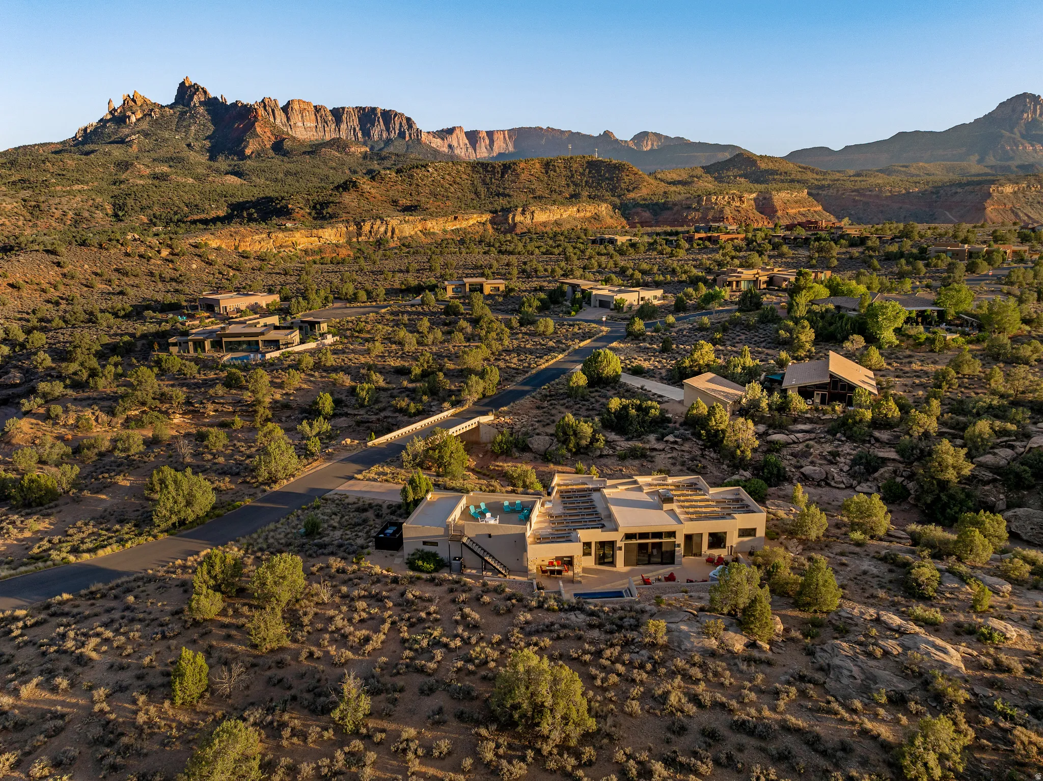 Daytime aerial of the home and lot from above.