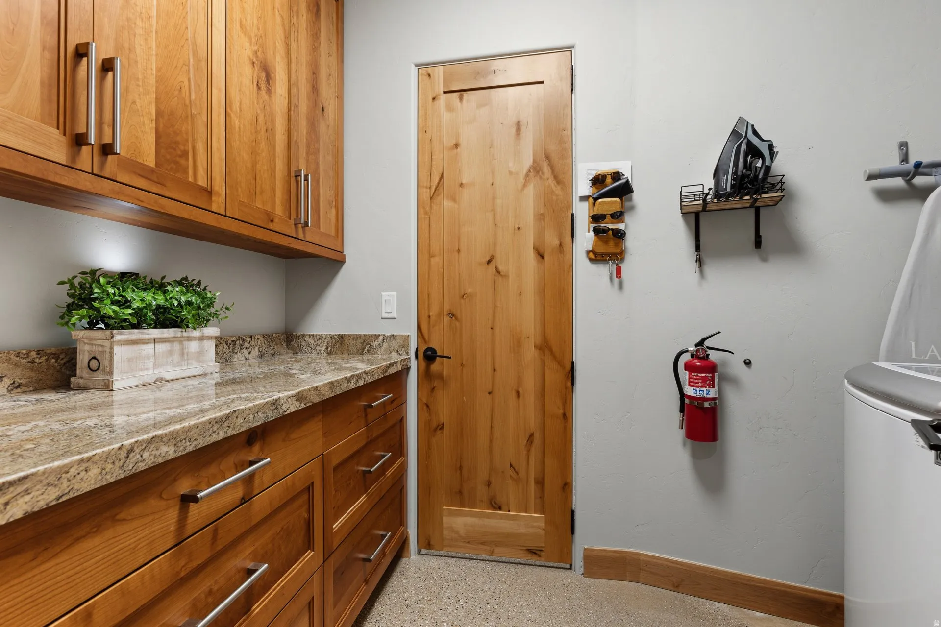 Custom cabinetry with under-cabinet lighting and granite-style countertops