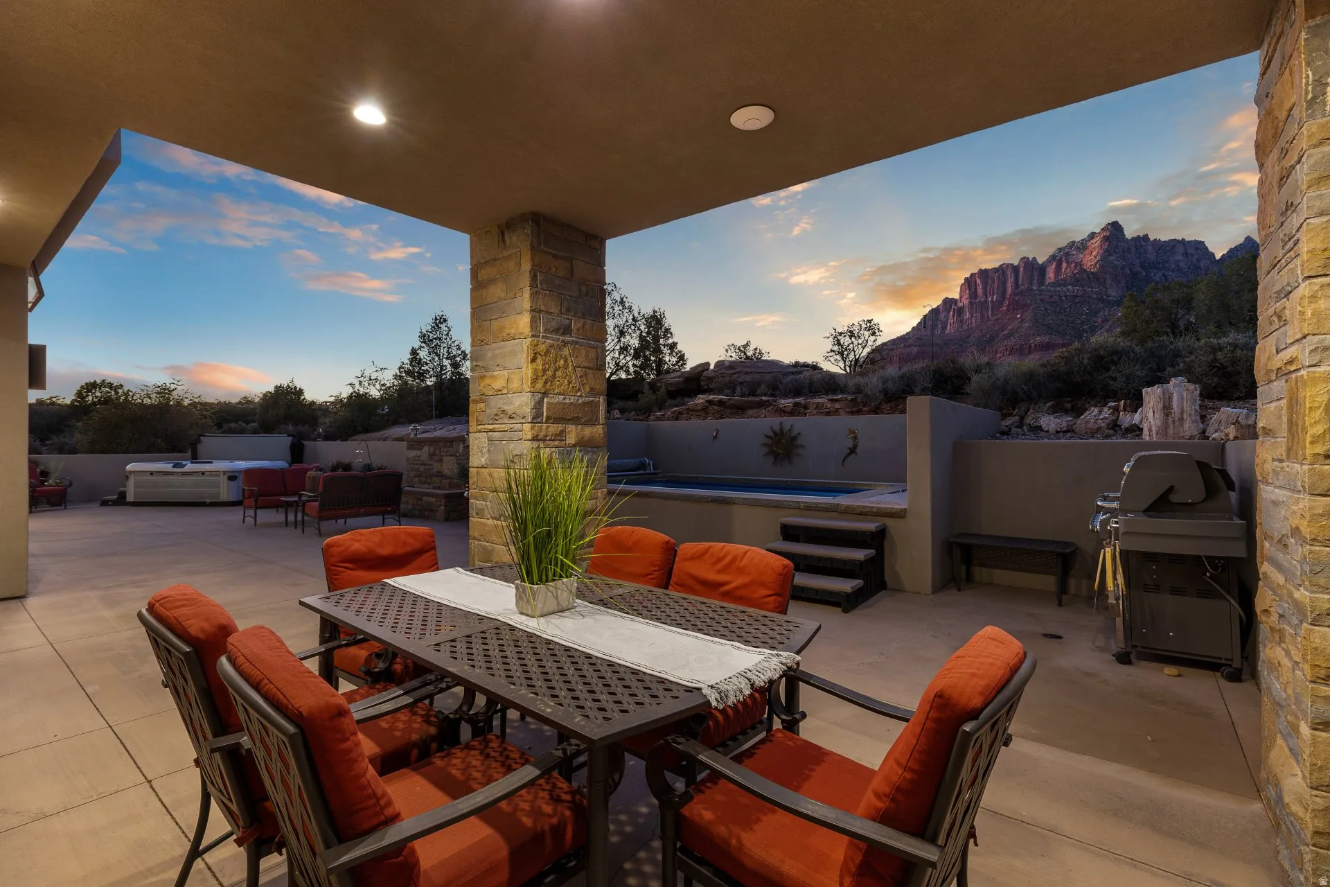 Covered patio featuring recessed lighting and a stone-clad pillar