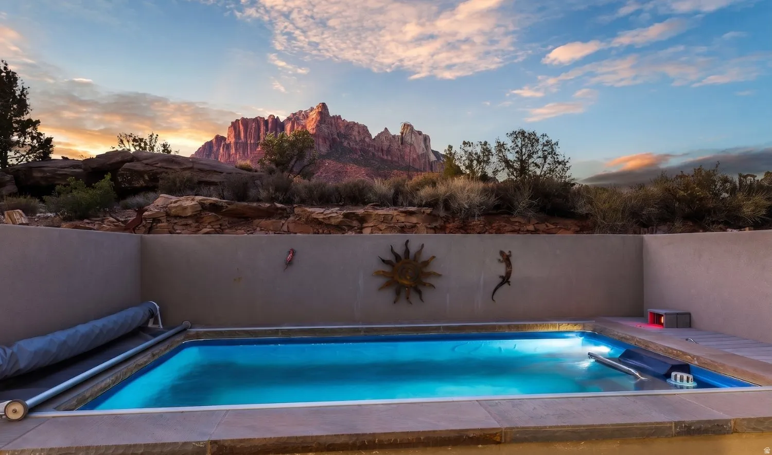Private plunge pool with integrated lighting and a neutral-toned concrete surround