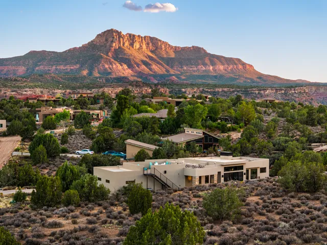 Contemporary desert residence featuring a flat roofline and multi-level design