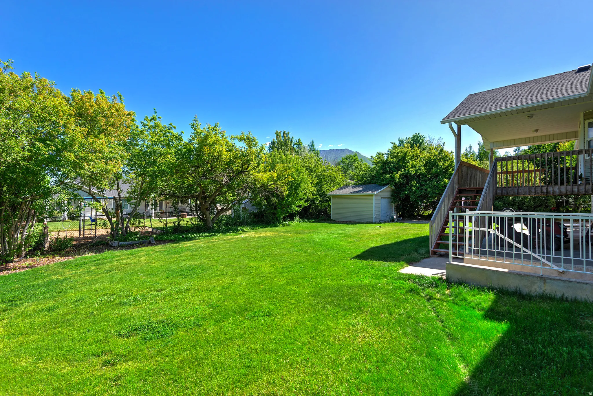 Expansive green lawn providing ample outdoor space