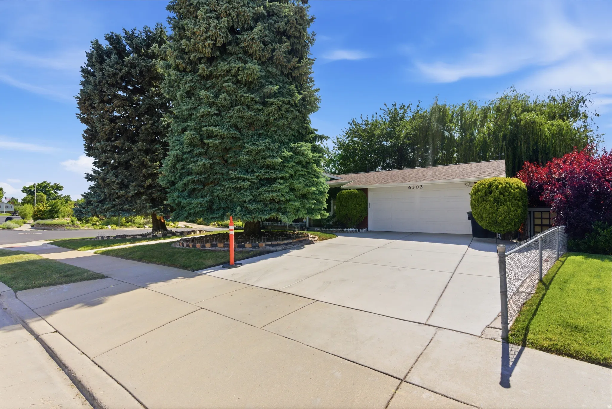 In addition to the attached 2-car garage, there is a huge detached 2-car garage that can accommodate vehicles while still providing space for a workshop