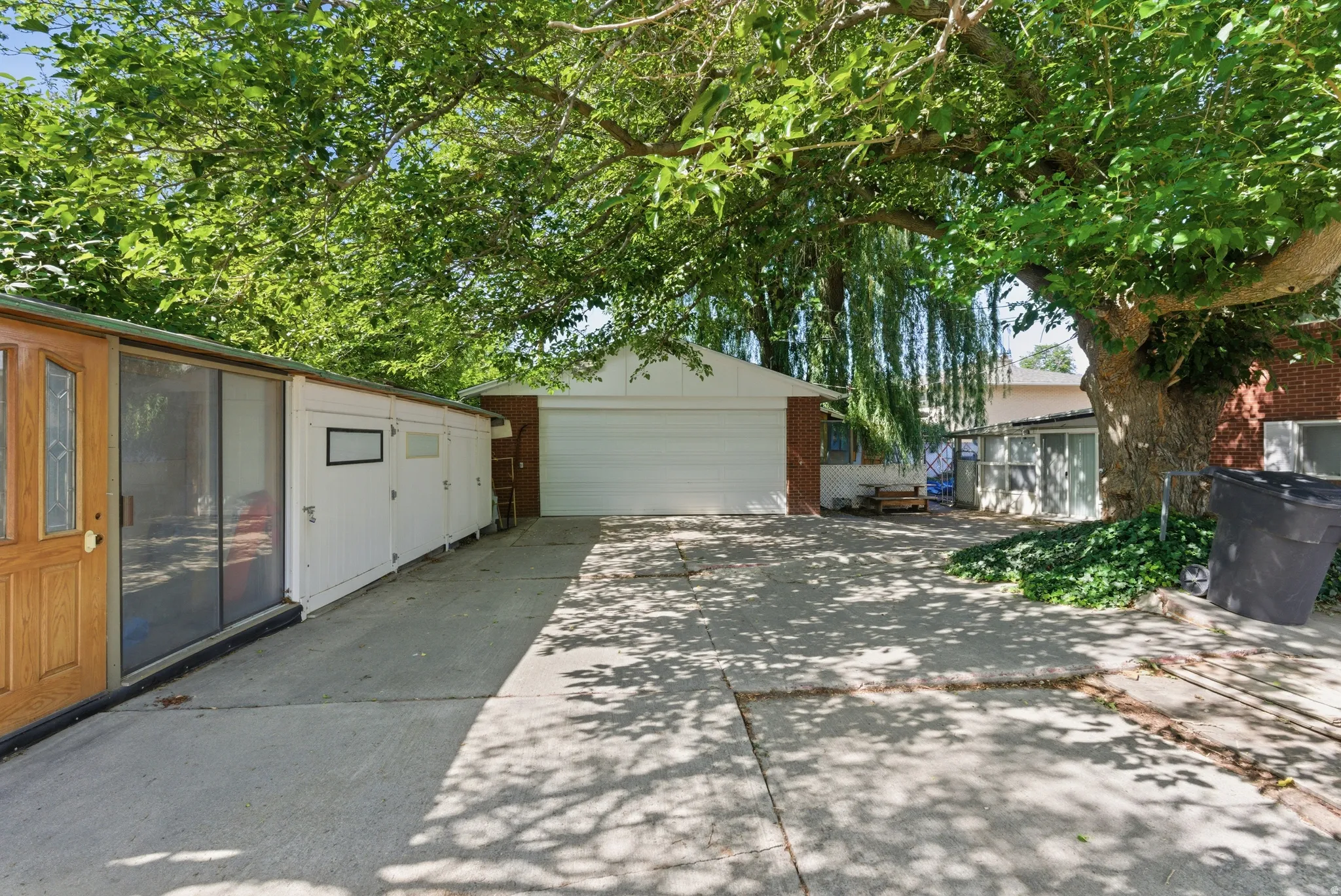 In addition to the attached 2-car garage, there is a huge detached 2-car garage that can accommodate vehicles while still providing space for a workshop