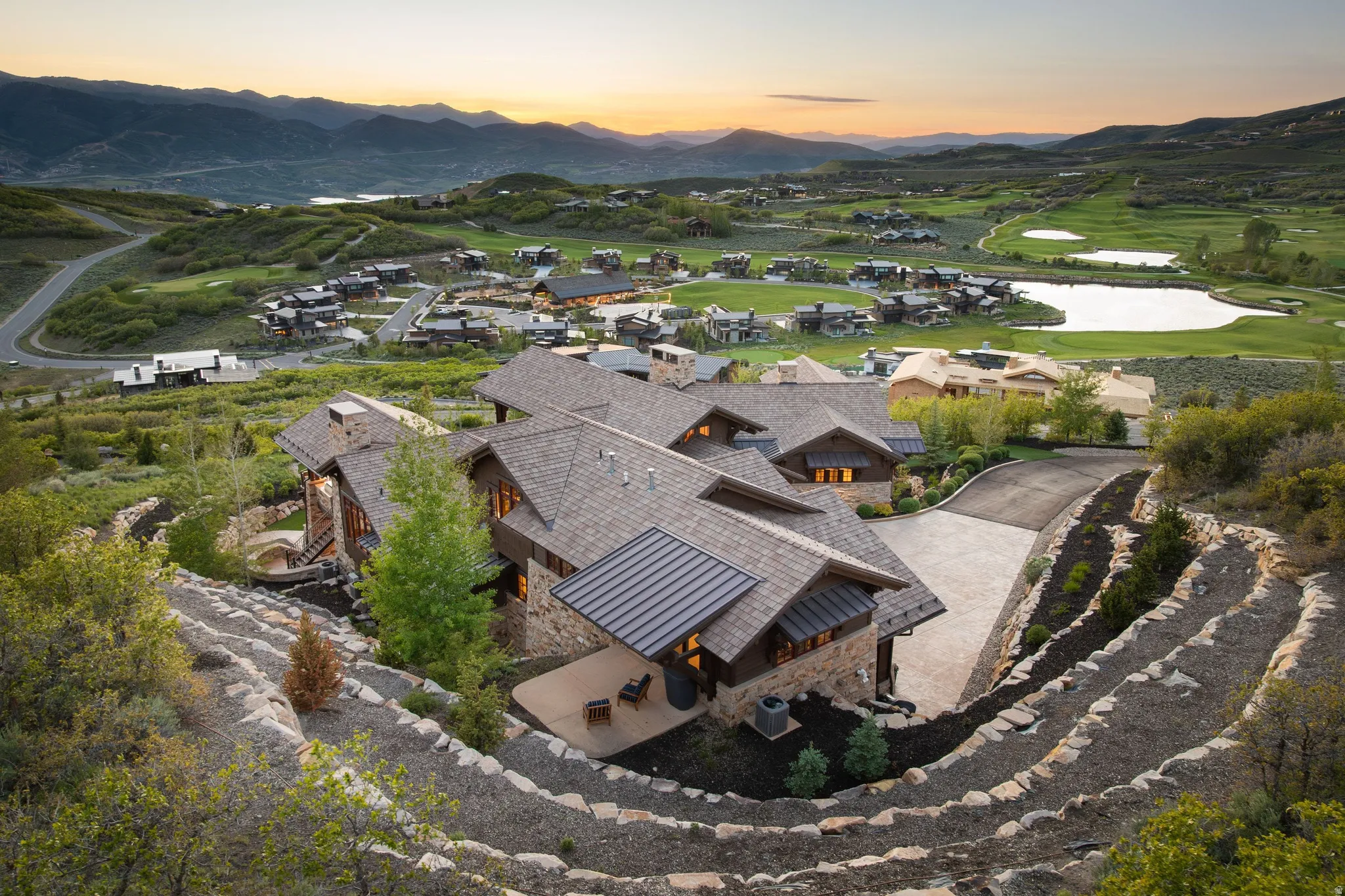 Stone and timber residence with multiple gables and a private driveway