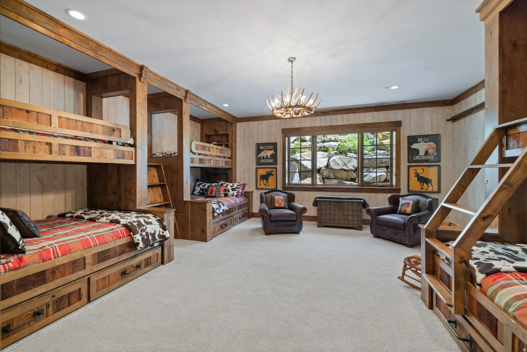 Spacious room featuring multiple built-in bunk beds with integrated storage drawers