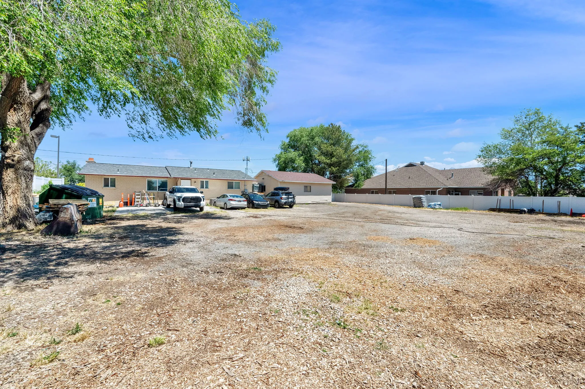 Expansive gravel and dirt lot offering substantial open space