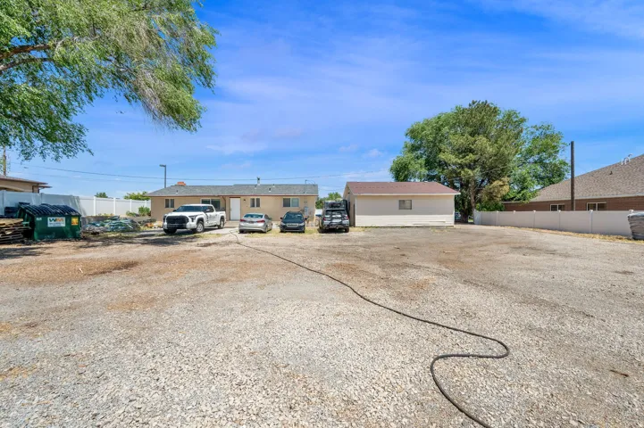 Expansive gravel lot offering ample parking
