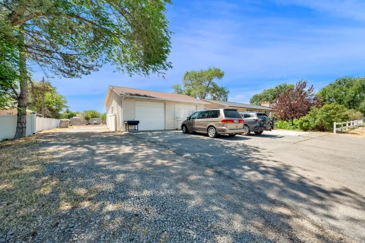 Expansive gravel driveway providing ample parking