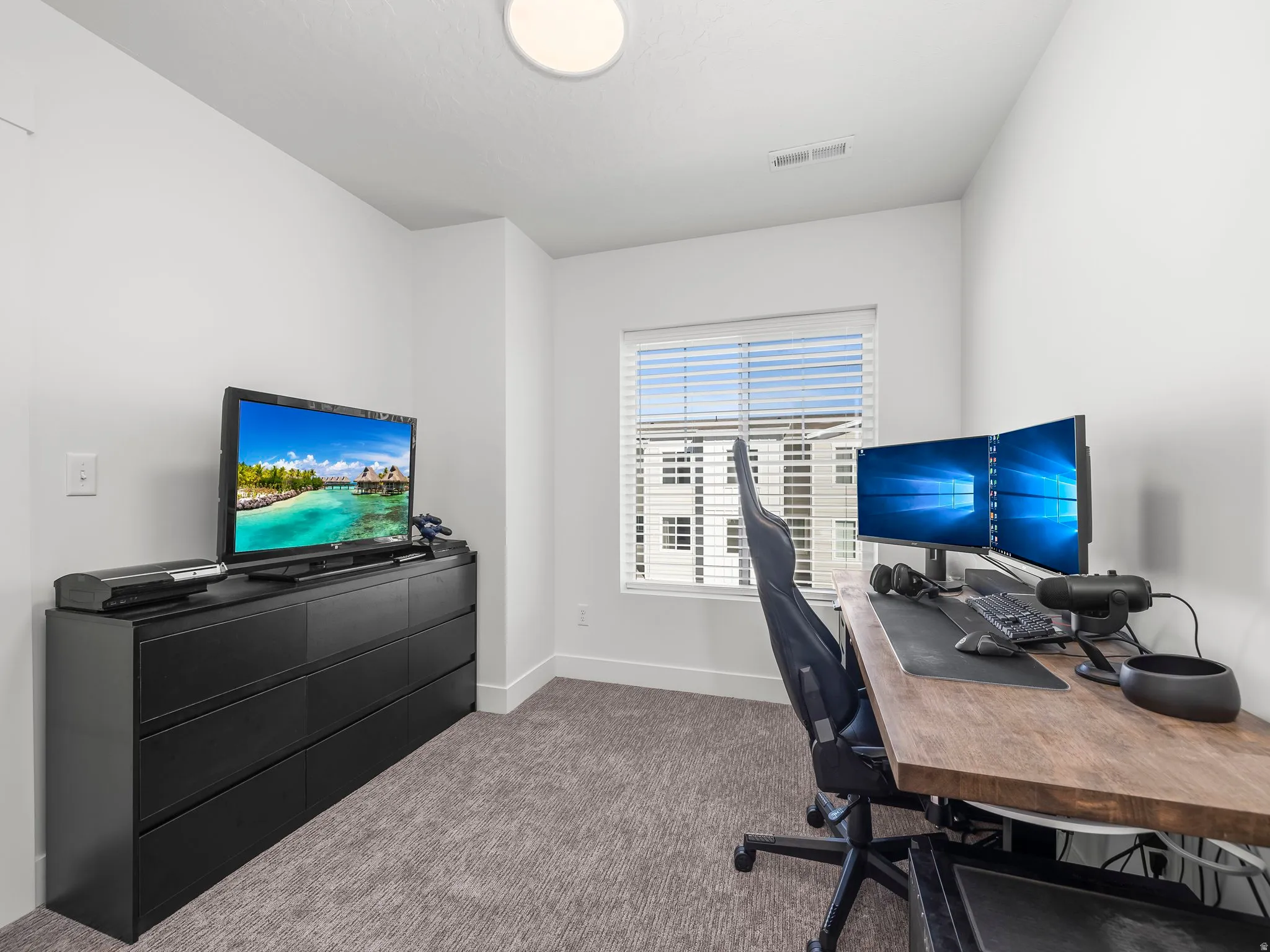 Room featuring light gray carpet flooring and white painted walls